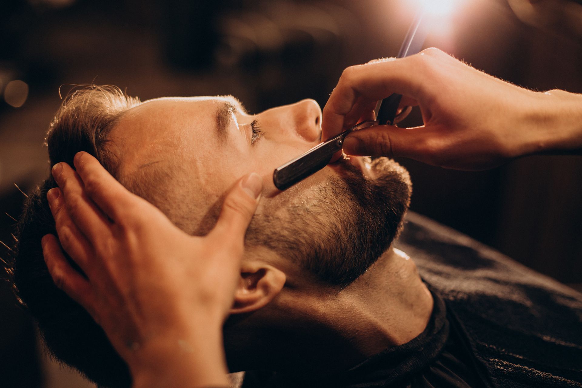 handsome-man-shaving-beard-barbershop